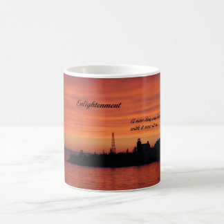 Coffee mug with picture of light house at sunrise.
