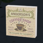 Coffee Shop Coffeehouse Cafe Lt Beans Personalized Wooden Box Sign<br><div class="desc">This personalized coffee shop wooden box sign is perfect for your cafe-themed home decor. Made in retro brown, green, purple, and hints of orange, this custom design includes a cup on a saucer, two banners with your text, and the words "Coffee Shop | Fresh Roast | Great Flavor." The mug...</div>