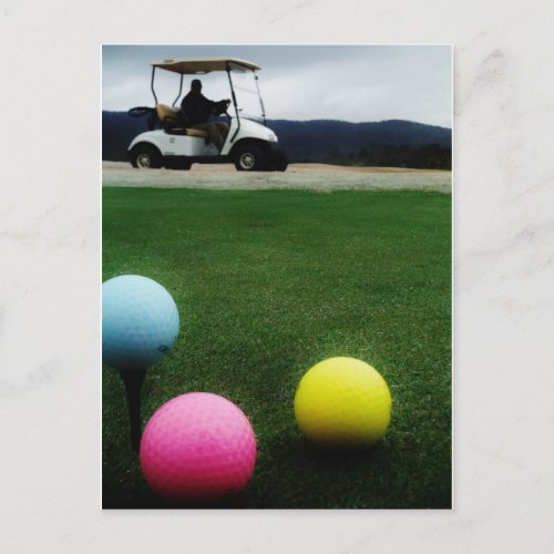 colored golf balls and cart postcard