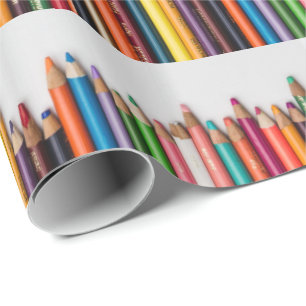 Colored pencils, paint, multi-colored artist tools wrapping paper