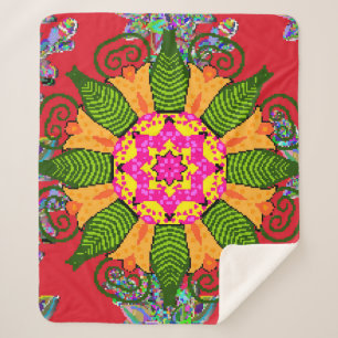Colored round floral mandala on a red,  green and  sherpa blanket