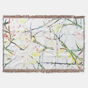 Colorful abstract floral design on white throw blanket
