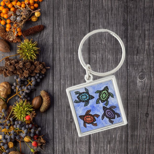 Colorful Abstract Turtles Keychain (Four black abstract turtles with coloured shells on blue keychain.)