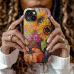 Colorful Autumn Floral and Pumpkins iPhone 15 Case<br><div class="desc">A vibrant, modern abstract painting showcasing a playful arrangement of pumpkins, sunflowers, and other fall foliage. Rich autumn hues like burnt orange, deep reds, pinks and golden yellows blend with soft brushstrokes and bold splashes of color. The abstract style adds a contemporary flair to the traditional fall harvest theme, capturing...</div>