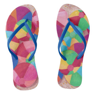 Colorful Beach Balls in Sand Flip Flops