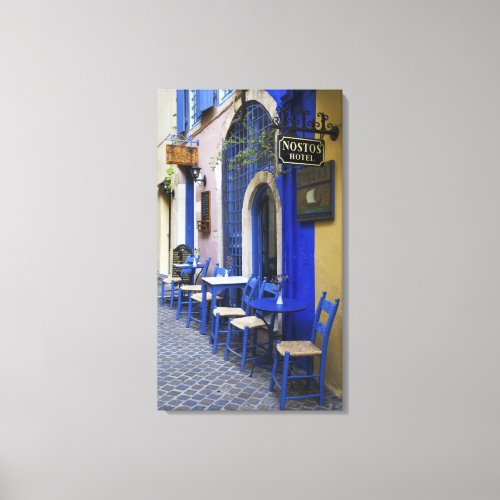 Colorful Blue doorway and siding to old hotel in Canvas Print
