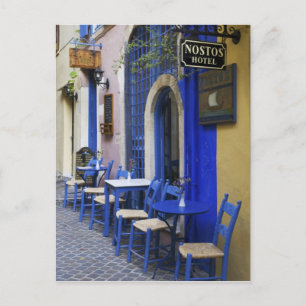 Colorful Blue doorway and siding to old hotel in Postcard