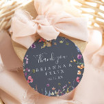 Colorful Blue Wild Floral Thank You Wedding Favor Classic Round Sticker<br><div class="desc">This colorful blue wild floral thank you wedding favor classic round sticker is perfect for a rustic wedding. The design features a yellow, purple, white wild flowers with foliage in a rose and green watercolor background. Make the sticker labels your own by including your names, the event (if applicable), and...</div>