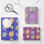Colorful Bright Spinning Dreidels Purple Hanukkah Wrapping Paper Sheets<br><div class="desc">A modern and colorful Hanukkah gift wrapping paper featuring colorful bright star of David twirling dreidels on a 3 shades of purple background.</div>