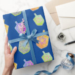 Colorful Bright Spinning Star Dreidels Hanukkah  Wrapping Paper<br><div class="desc">A modern and colorful Hanukkah gift wrapping paper featuring colorful bright star of David twirling dreidels on a solid rich deep blue background.</div>