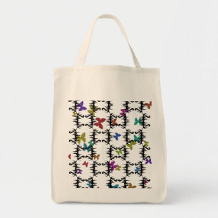 Colorful butterflies behind an iron gate tote bag
