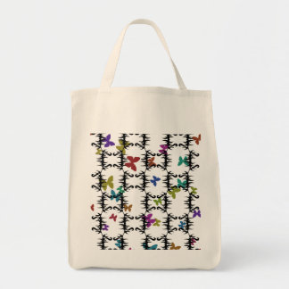 Colorful butterflies behind an iron gate tote bag