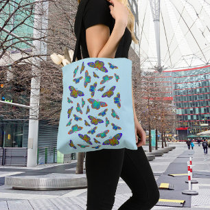 Colorful butterflies on baby blue tote bag