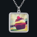 Colorful Cupcake with Cherry on Top Silver Plated Necklace<br><div class="desc">A bright summery photo of a delicious cupcake. This image has white fluffy clouds amd mountains in the background. The yummy cupcake is contained in a bright pink and purple red wrapper. The cupcake itself is a combination of vanilla cake and chocolate icing with a juicy cherry on top with...</div>