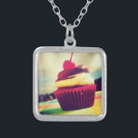 Colorful Cupcake with Cherry on Top Silver Plated Necklace<br><div class="desc">A bright summery photo of a delicious cupcake. This image has white fluffy clouds amd mountains in the background. The yummy cupcake is contained in a bright pink and purple red wrapper. The cupcake itself is a combination of vanilla cake and chocolate icing with a juicy cherry on top with...</div>
