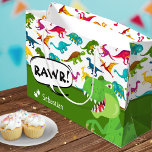 Colorful Dinosaur Pattern with Name T-Rex Green Large Gift Bag<br><div class="desc">Does your little boy or girl love dinosaurs? This custom birthday party gift bag is perfect! There's a big T-Rex saying RAWR, dinosaur footprints and your little kid's name on white, a green background, and a fun colorful dino pattern. This gift bag makes a great personalized addition to your birthday...</div>