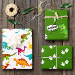 Colorful Dinosaur Pattern with Name Wrapping Paper Sheets<br><div class="desc">Does your little boy or girl love dinosaurs? This custom birthday party wrapping paper is perfect! There's a big T-Rex saying RAWR, dinosaur footprints and your little kid's name on white, a green background, and a fun colorful dino pattern. This gift wrap makes a great personalized addition to your present...</div>