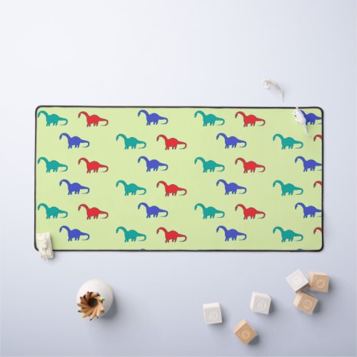 Colorful dinosaurs pattern on green desk mat