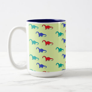 Colorful dinosaurs pattern on green Two-Tone coffee mug