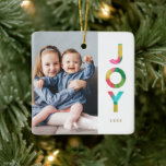 Colorful Festive JOY Christmas Photo Ceramic Ornament<br><div class="desc">Add a touch of color to your Christmas tree with this fun, bright holiday photo ornament, featuring colorful typography reading, "JOY." The word JOY is designed with an overlapping tissue paper look in bold colors of green, lime, pink, red, aqua blue, and golden yellow. *Artwork created exclusively by Orabella Prints....</div>