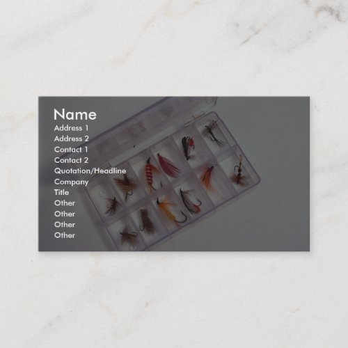 Colorful fishing hooks kept in fly box business card