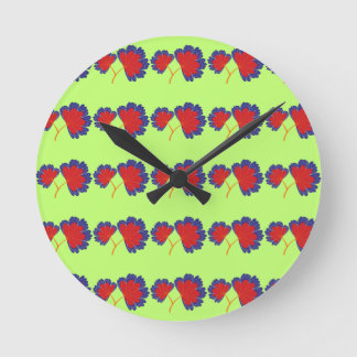 Colorful Flower Pattern on Green Background Round Clock