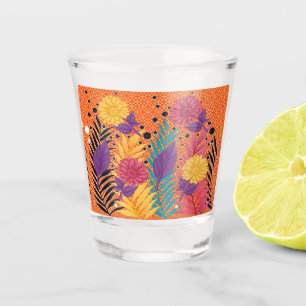 colorful flowers and leaves on a black background shot glass