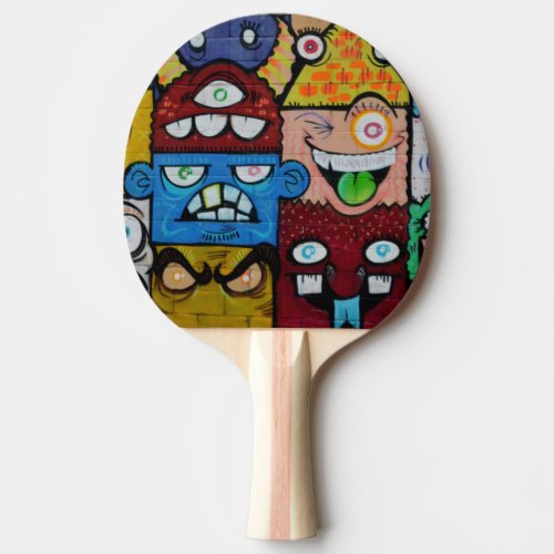 Colorful graffiti faces art designed ping pong paddle