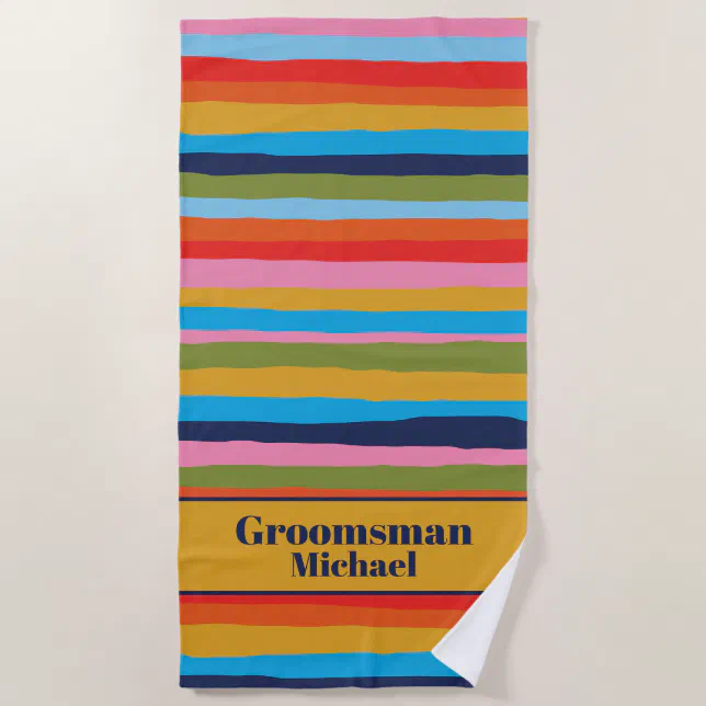 Colorful striped personalized beach towel with groomsman's name.