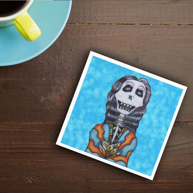 Colorful Happy Day of the Dead Skeleton Paper Napkins (Smiling Day of the Dead femal skeleton black hair orange blue cape flowers on vibrant blue napkins.)