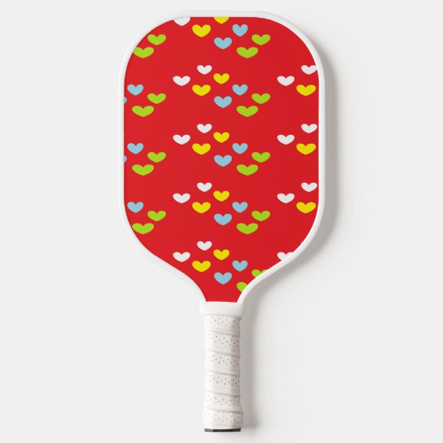Colorful hearts on red pickleball paddle (Front)