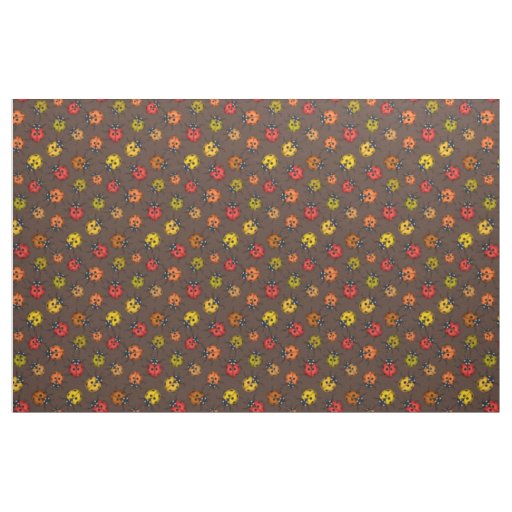 Colorful ladybugs on brown fabric