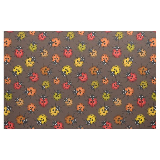 Colorful ladybugs on brown fabric