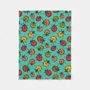 Colorful ladybugs on turquoise fleece blanket