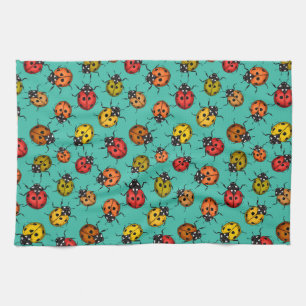 Colorful ladybugs on turquoise kitchen towel