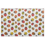 Colorful ladybugs on white fabric