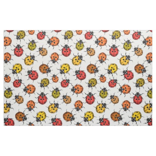 Colorful ladybugs on white fabric