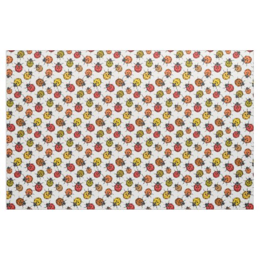 Colorful ladybugs on white fabric