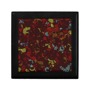 Colorful leaves and flowers against camouflage gift box