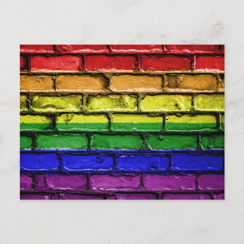 Colorful LGBT rainbow pride flag brick wall Postcard