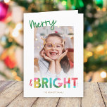 Colorful Merry and Bright Christmas Photo Greeting Holiday Card<br><div class="desc">This fun, bright Christmas holiday greeting card features colorful text, reading, "Merry & Bright" in green, lime, cherry red, pink, golden yellow, and aqua. The typography for the word "Bright" incorporates an overlapping tissue paper design. This lighthearted card evokes a sense of playfulness, laughter, and childhood joy in the simple...</div>