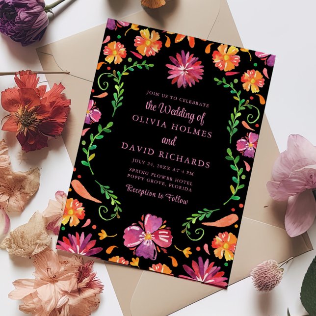 Colorful Mexican Floral Fiesta Wedding Invitation (Colorful Mexican Floral Fiesta Wedding Invitation on a table full with colorful flowers.)