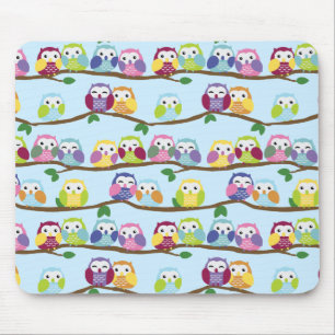 Colorful owls on a branch mouse pad