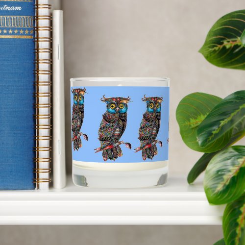 Colorful owls on blue scented candle