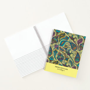 Colorful paisley ethnic pattern on yellow notebook