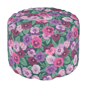 Colorful pansies on dark greenish blue pouf