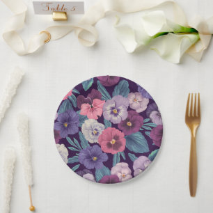 Colorful pansies on deep violet paper plates