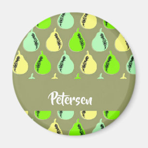 Colorful pears on green magnet