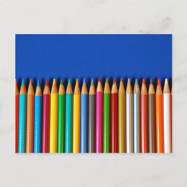 Colorful pencil crayons on blue background postcard (Front)