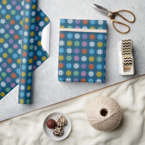 Colorful Pixel Snowflake Pattern on Navy Blue Wrapping Paper